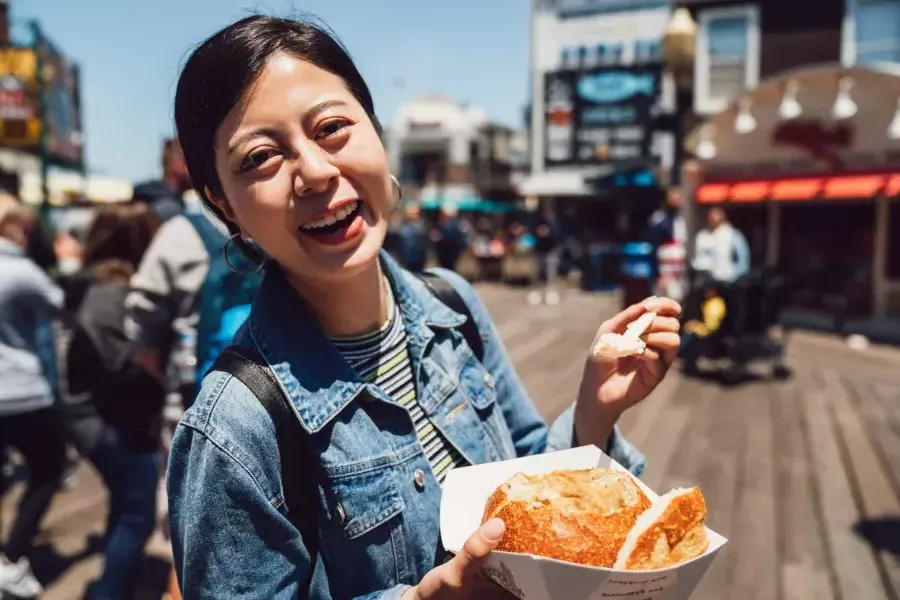 Woman with chowder at PIER 39